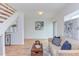 Bright living room features hardwood floors, neutral paint, and stylish furniture at 524 N Occoneechee St, Hillsborough, NC 27278