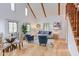 Bright living space featuring hardwood floors, exposed beams, and comfortable seating arrangements at 524 N Occoneechee St, Hillsborough, NC 27278