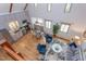 Bright, airy living room with high ceilings, natural light, and an open floor plan adjacent to a modern kitchen at 524 N Occoneechee St, Hillsborough, NC 27278