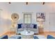 Cozy living room features a comfortable sofa, side tables with lamps, and a decorative mirror at 524 N Occoneechee St, Hillsborough, NC 27278