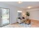 This living room features a comfortable couch, a coffee table, and access to the outdoors at 524 N Occoneechee St, Hillsborough, NC 27278