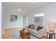 Inviting living room with neutral sofa, decor, and a sliding glass door at 524 N Occoneechee St, Hillsborough, NC 27278