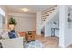 Bright living room showcases a staircase and modern decor, creating an inviting space at 524 N Occoneechee St, Hillsborough, NC 27278