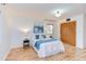 Bright bedroom with a comfortable bed, side tables, and wood-look flooring at 524 N Occoneechee St, Hillsborough, NC 27278