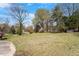 Spacious yard surrounded by trees, creating a private and serene outdoor retreat at 524 N Occoneechee St, Hillsborough, NC 27278