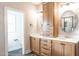 Charming bathroom with double sinks, neutral cabinets, and decorative mirrors and fixtures at 525 Sanctuary Trl, Cameron, NC 28326