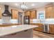 Well-appointed kitchen with stainless appliances, a modern island, and ample counter space at 525 Sanctuary Trl, Cameron, NC 28326