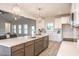 Open-concept kitchen featuring an island with a sink and ample counter space at 525 Sanctuary Trl, Cameron, NC 28326