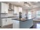 Well-lit kitchen featuring an island with seating and stainless steel appliances at 525 Sanctuary Trl, Cameron, NC 28326
