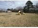 Backyard featuring play set in a fenced yard at 528 Mill St, Smithfield, NC 27577