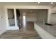 Open-concept living area featuring luxury vinyl plank flooring and natural light throughout at 605 Leland Hl Cir, Zebulon, NC 27597