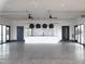 Expansive community center features modern kitchen and spacious gathering area at 615 Leland Hl Cir, Zebulon, NC 27597