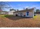 View of the property's spacious backyard and patio area at 629 Martin St, Durham, NC 27704