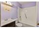 Simple bathroom with a shower and bath and a modern sink and vanity at 629 Martin St, Durham, NC 27704