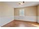 Spacious bedroom with laminate flooring and a large window at 629 Martin St, Durham, NC 27704