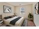 Comfortable bedroom with neutral tones, large window, and cozy decor create a relaxing retreat at 629 Martin St, Durham, NC 27704