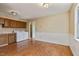 Open kitchen area featuring ample cabinet space, white appliances, and laundry facilities at 629 Martin St, Durham, NC 27704