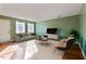 Inviting living room featuring stylish furniture, large windows for natural light, and a relaxing atmosphere at 629 Martin St, Durham, NC 27704