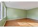 Spacious living room offers ample natural light and features wood flooring at 629 Martin St, Durham, NC 27704