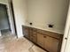 Bathroom features double vanity with sleek countertops and contemporary fixtures at 63 Daybreak Way, Fuquay Varina, NC 27526