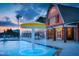 A splash fountain feature stands near the clubhouse in the community pool area at 63 Daybreak Way, Fuquay Varina, NC 27526