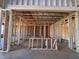 Interior framing of a new home build shows the stud and header construction at 63 Daybreak Way, Fuquay Varina, NC 27526