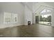Bright and airy living room with fireplace, large windows, and sliding glass doors to the patio at 63 Daybreak Way, Fuquay Varina, NC 27526
