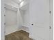 Bright mudroom with storage bench and closet, plus access to laundry room and stylish flooring at 63 Daybreak Way, Fuquay Varina, NC 27526