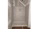 Bathroom shower with marble tile walls and a modern shower base at 63 Daybreak Way, Fuquay Varina, NC 27526