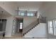 Staircase with wood treads and metal balusters in open foyer at 63 Daybreak Way, Fuquay Varina, NC 27526