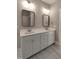 Double vanity bathroom with bright lighting, framed mirrors and updated fixtures at 632 Angus Ct, Sanford, NC 27332
