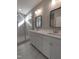 This bathroom has a double vanity with a shower and glass door in the background at 632 Angus Ct, Sanford, NC 27332