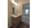 Bathroom with modern vanity, quartz countertop, and view to the bedroom at 632 Angus Ct, Sanford, NC 27332