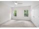 Bright bedroom with neutral carpet, large windows, and a ceiling fan at 632 Angus Ct, Sanford, NC 27332