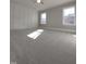 Spacious bedroom features decorative trim and large windows for abundant natural light at 632 Angus Ct, Sanford, NC 27332