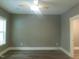 Spacious bedroom with hardwood floors and a ceiling fan with trim work at 632 Angus Ct, Sanford, NC 27332