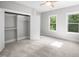 Bright bedroom with natural light, closet, and a ceiling fan creating an inviting and comfortable space at 632 Angus Ct, Sanford, NC 27332