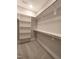 This walk-in closet offers ample storage with shelving and hanging rods at 632 Angus Ct, Sanford, NC 27332