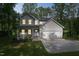 Two-story home boasting a welcoming front porch, attached two-car garage, and professional landscaping at 632 Angus Ct, Sanford, NC 27332
