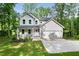 Charming two-story home features a covered porch, two-car garage, and a well-maintained lawn at 632 Angus Ct, Sanford, NC 27332