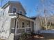 Two-story home featuring a covered porch, and a spacious driveway leading to a two-car garage at 632 Angus Ct, Sanford, NC 27332