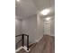 Upstairs hallway with modern railings and lots of natural light at 632 Angus Ct, Sanford, NC 27332