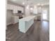 Well-lit kitchen boasts stainless steel appliances and a large island at 632 Angus Ct, Sanford, NC 27332