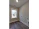 Spacious laundry room with modern hookups and luxury vinyl plank flooring and a bright window at 632 Angus Ct, Sanford, NC 27332
