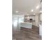 Spacious living area with recessed lighting, kitchen island, and wood-look flooring at 632 Angus Ct, Sanford, NC 27332