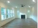 Bright living room with a cozy fireplace and multiple windows at 632 Angus Ct, Sanford, NC 27332