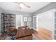 Well-lit home office featuring a sleek desk, hardwood floors, and stylish decor for a productive workspace at 632 Angus Ct, Sanford, NC 27332