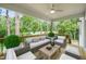 Relaxing outdoor patio with comfortable seating and scenic views of lush greenery and a golf course at 632 Angus Ct, Sanford, NC 27332