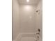 Modern shower featuring white subway tile and brushed nickel fixtures for a clean, contemporary look at 632 Angus Ct, Sanford, NC 27332