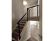 Open staircase features modern railing, wood treads, and transitions to bright, open living space at 632 Angus Ct, Sanford, NC 27332